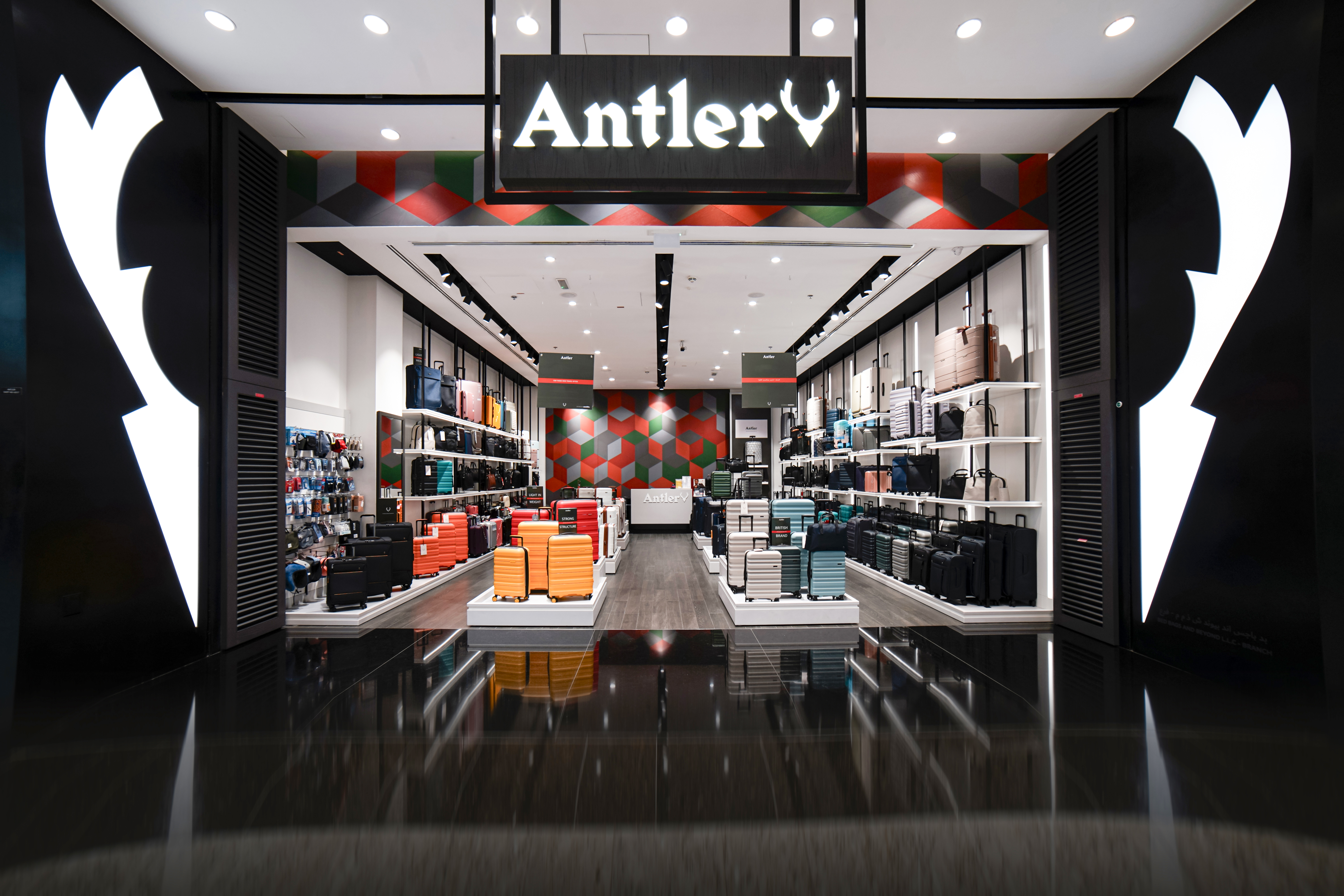 Wide Antler store entrance with luggage displays.
