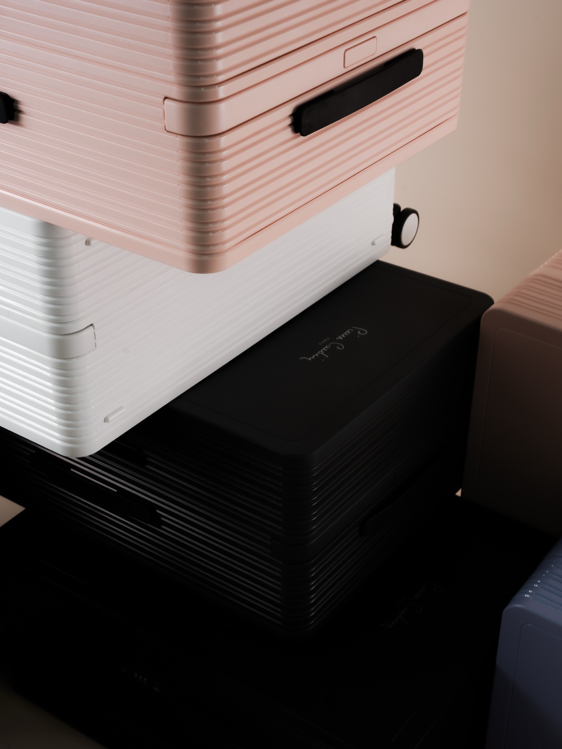 Pierre Cardin luggage collection in blush, white, and black