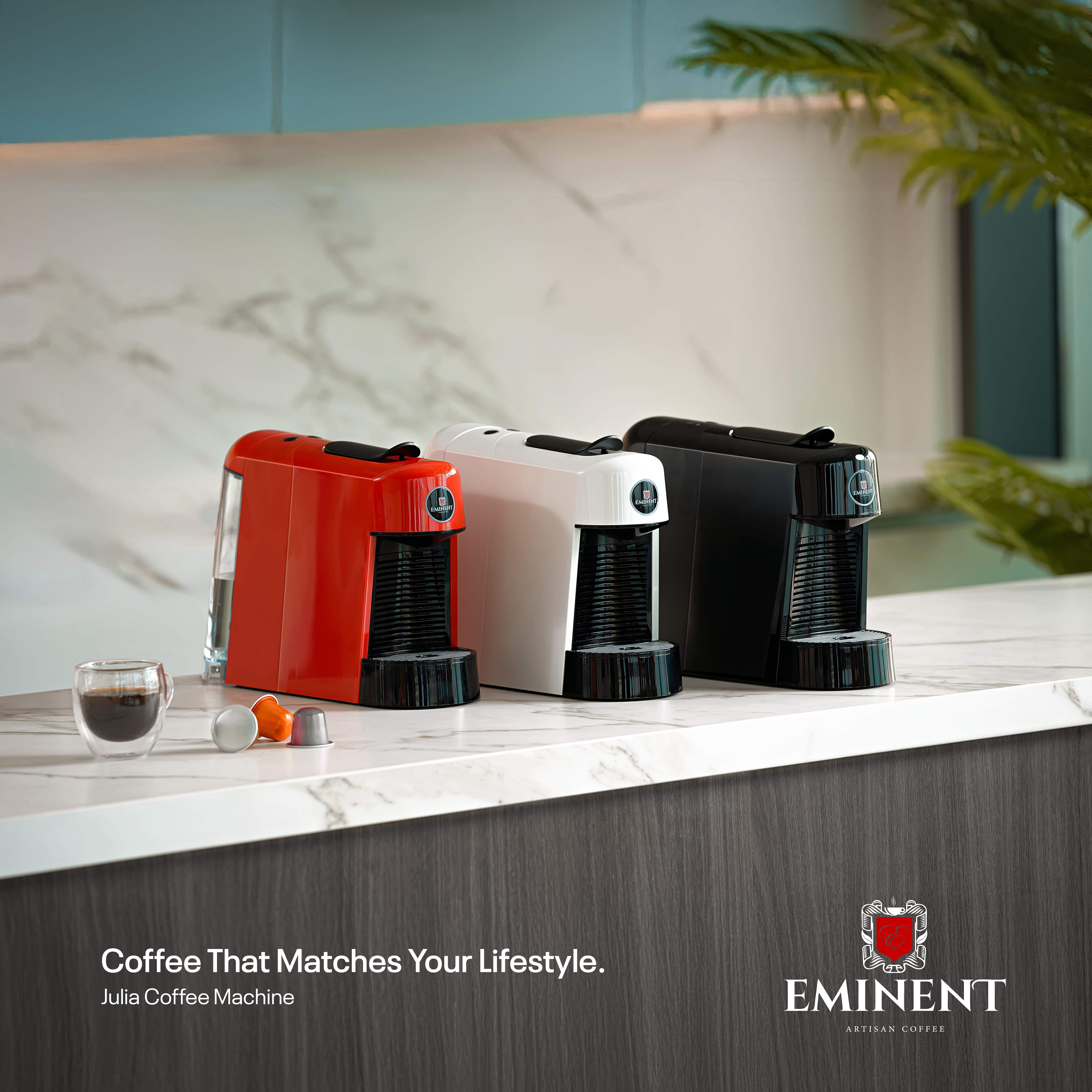 Eminent coffee machines in red, white, and black.