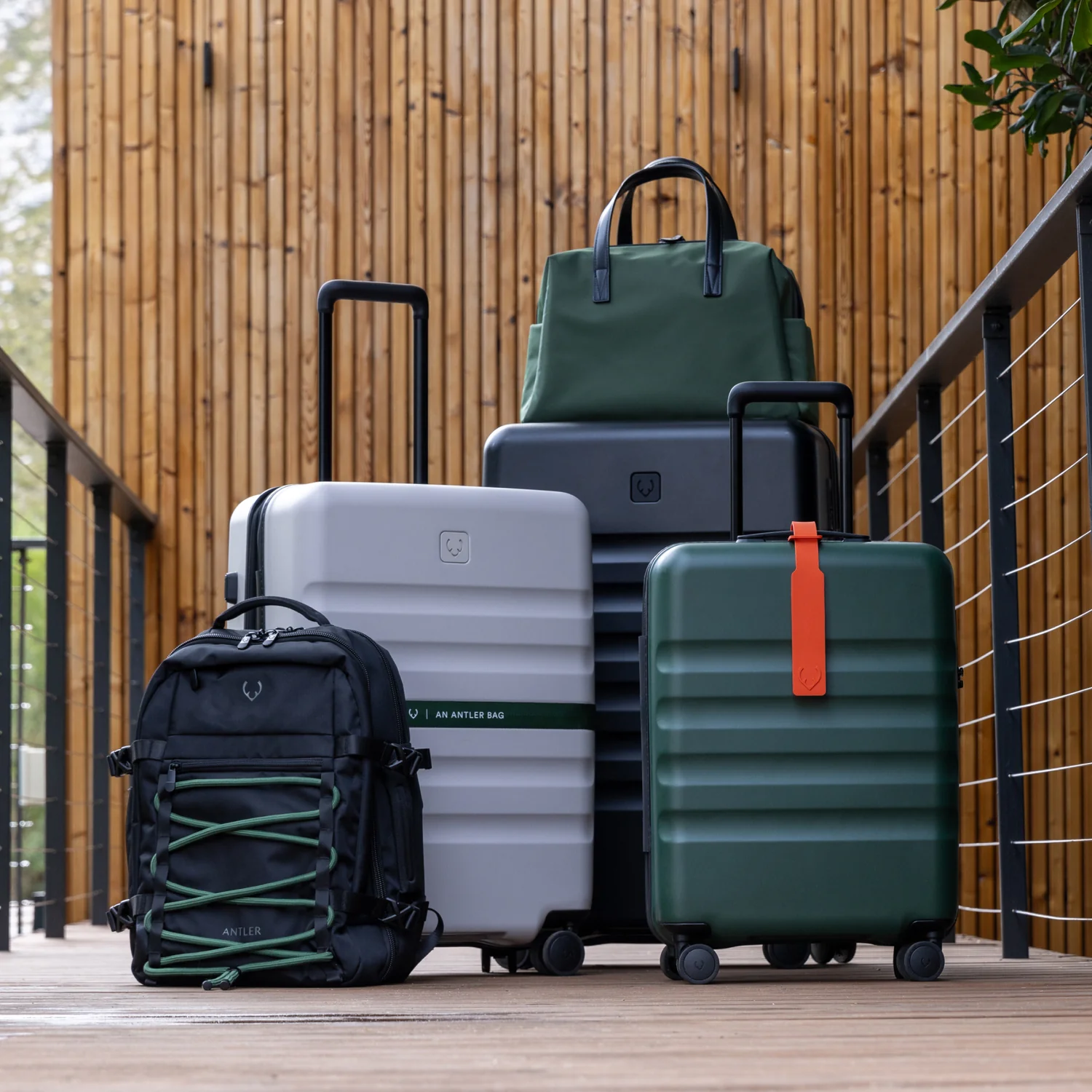 Antler luggage and bags arranged outdoors.
