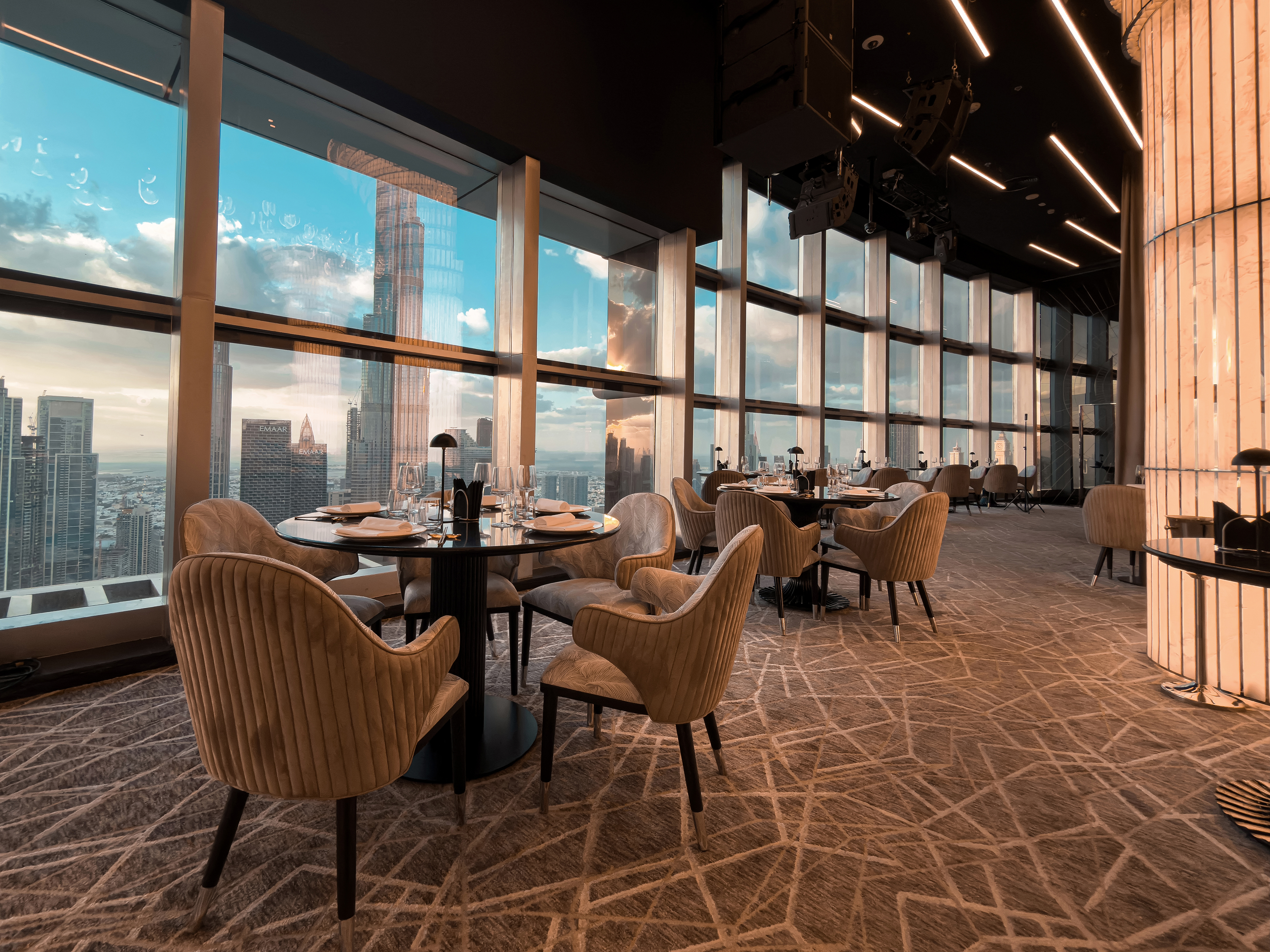 Window dining area at BIRDS Dubai with Burj Khalifa views.