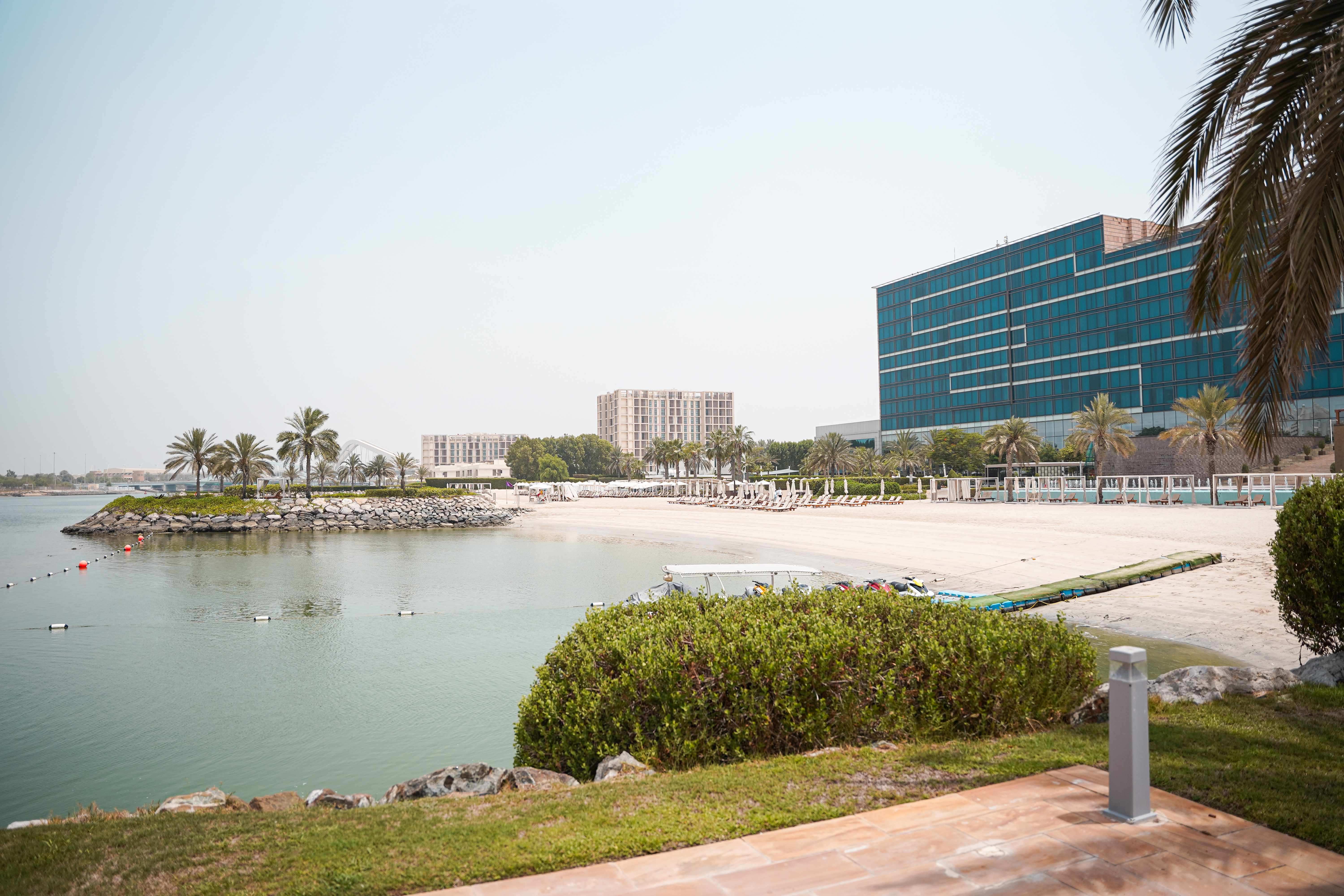 Fairmont Bab Al Bahr waterfront hotel and beach area.