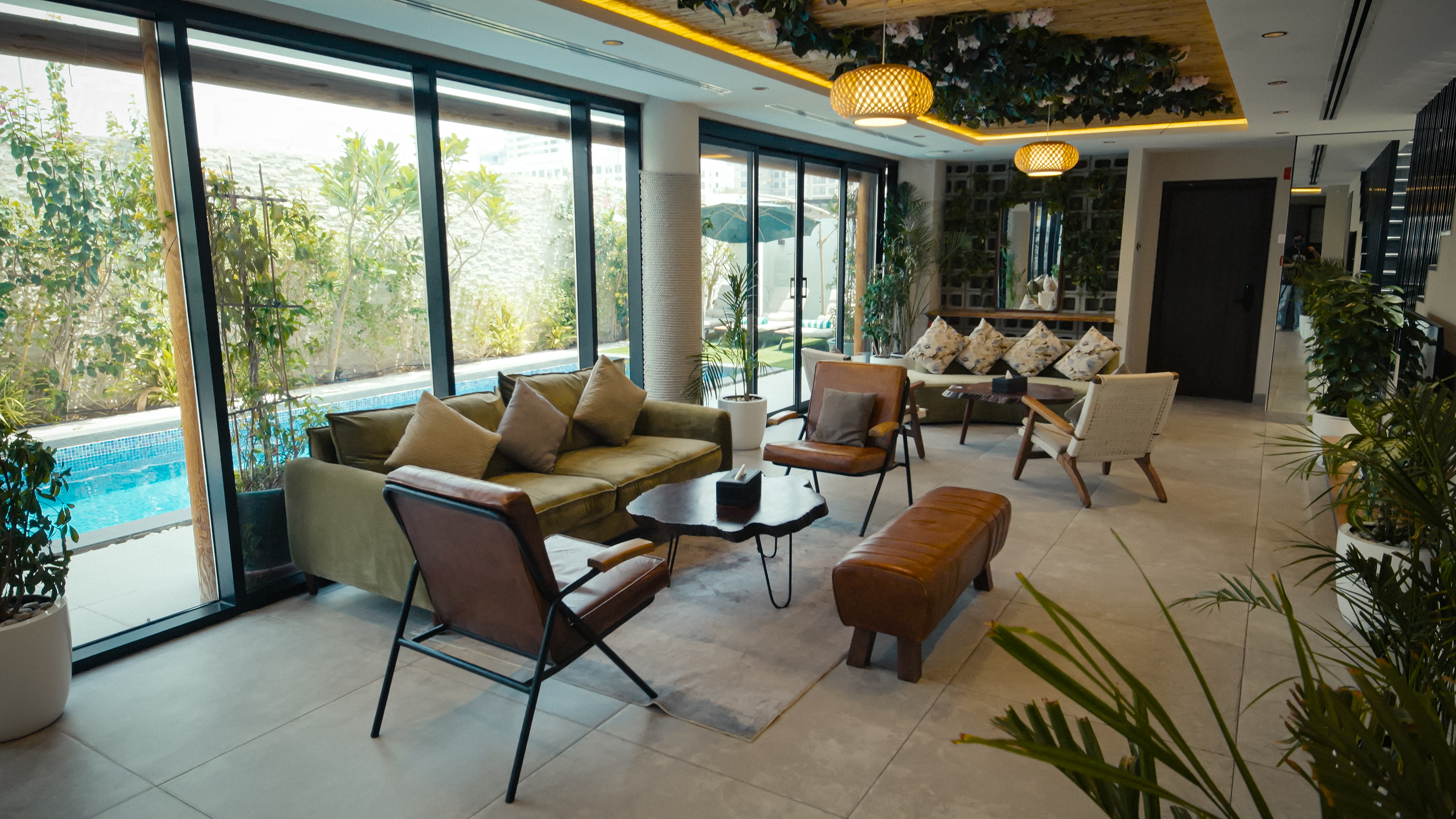 NAS House lounge area with warm seating beside the pool.