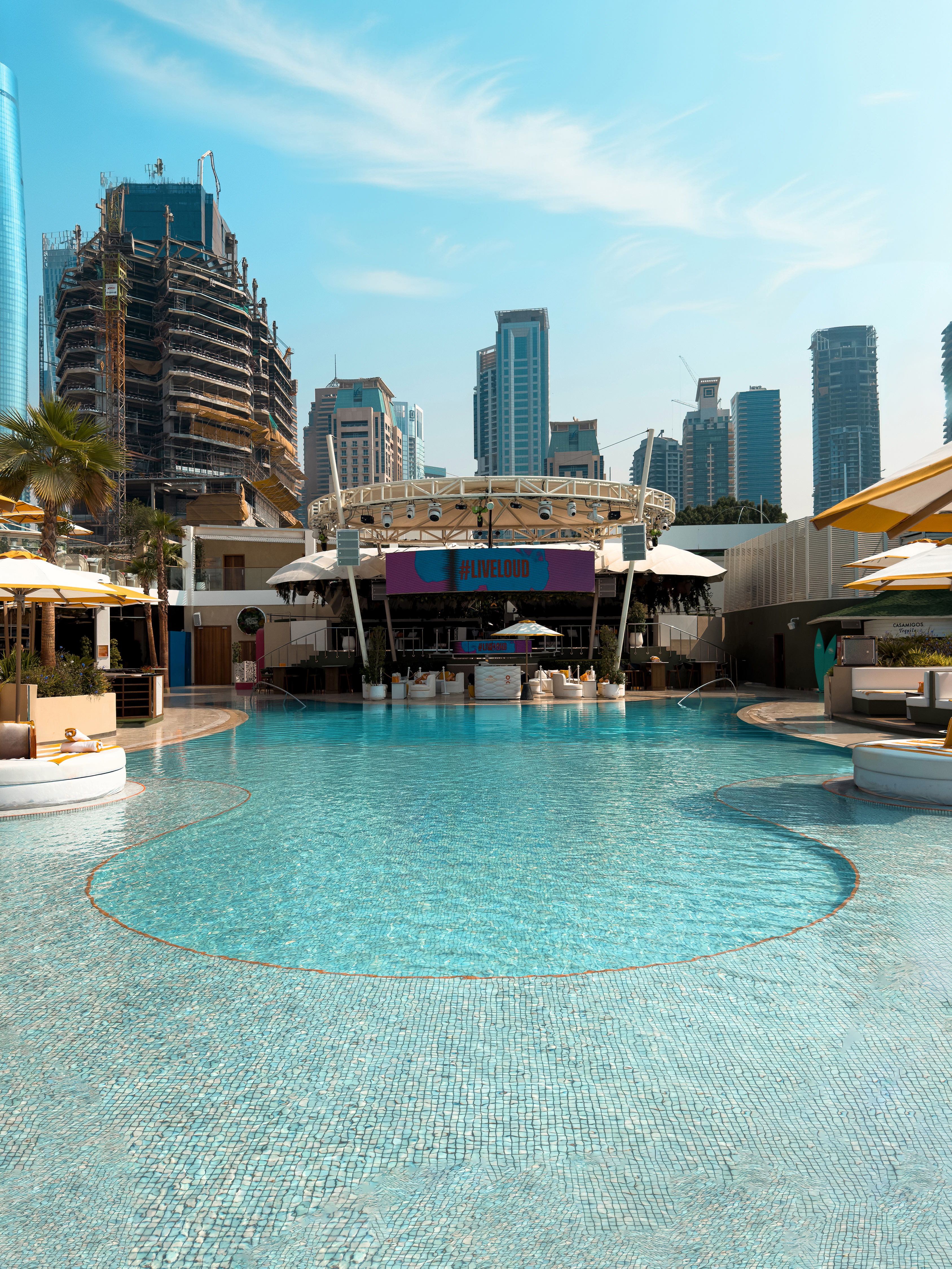Vertical view of the pool and performance stage at O Beach Dubai.