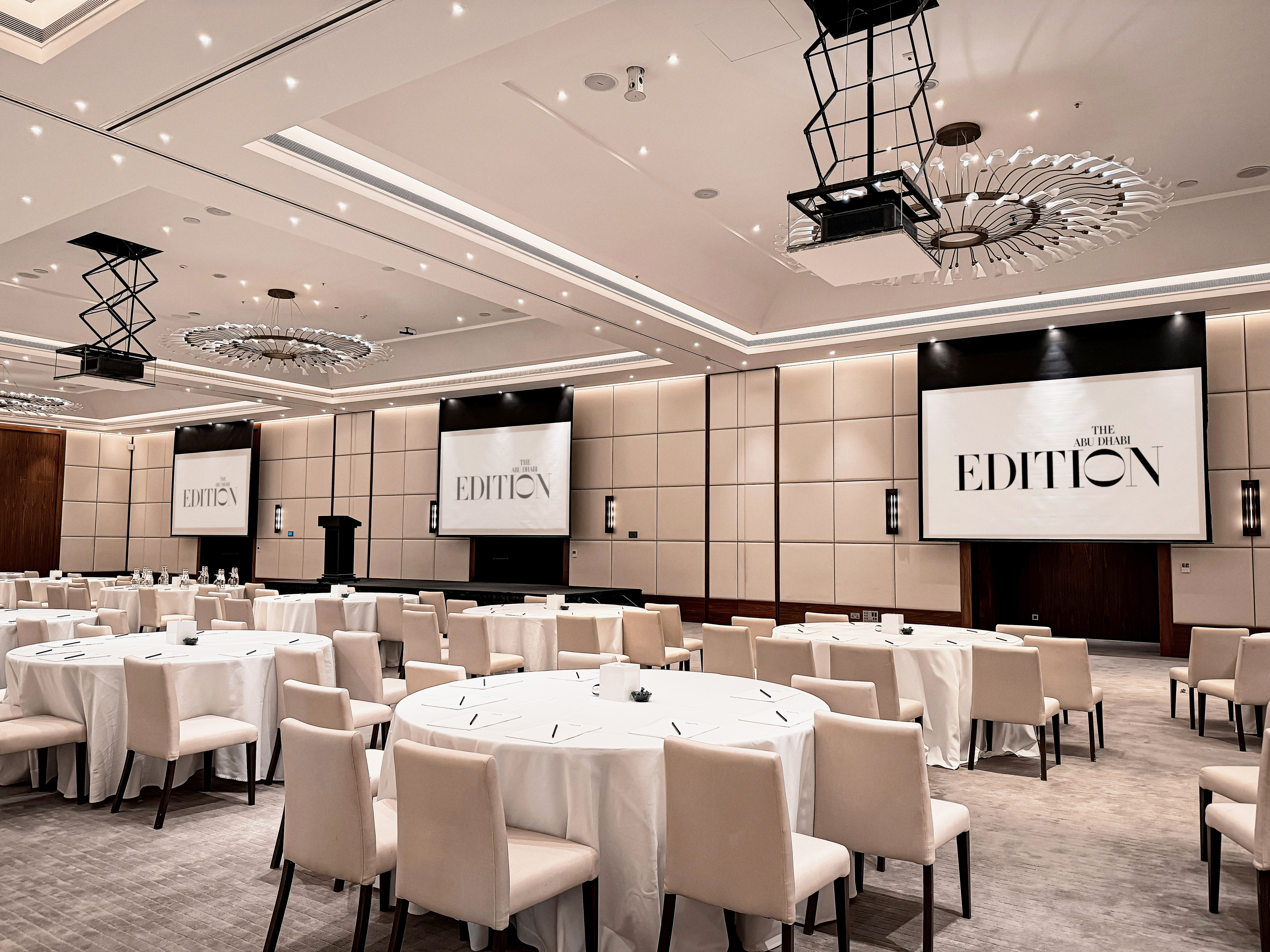 Ballroom with event tables and EDITION screens.