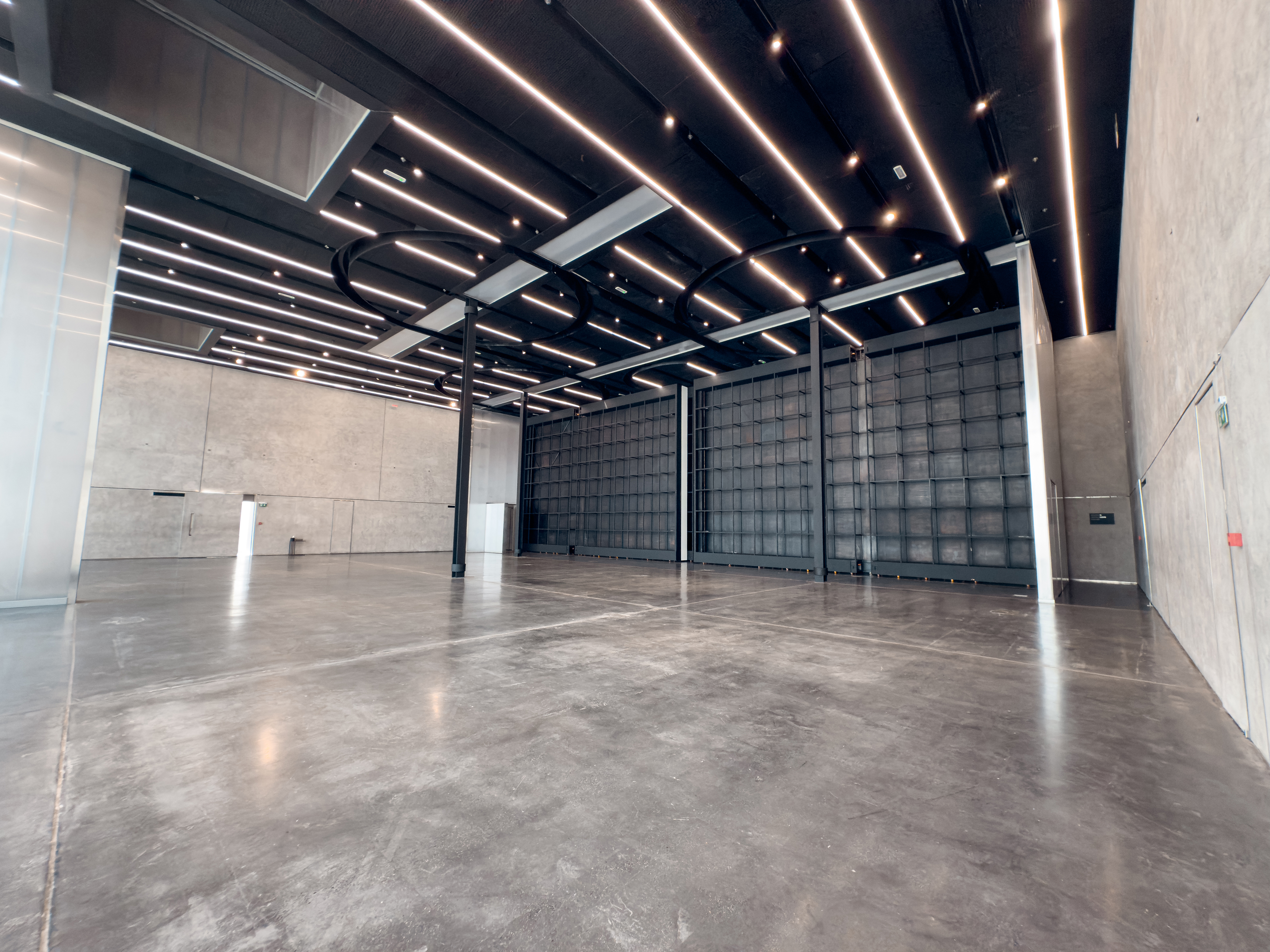 Black-ceiling event hall at Alserkal Avenue